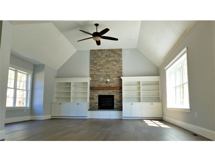 Residential interior painting viewed across adjoining rooms
